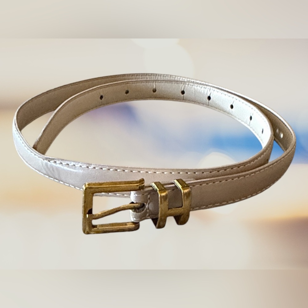 New w/o tags. Gold Buckle in a letter H. Beige Belt. 37” long.